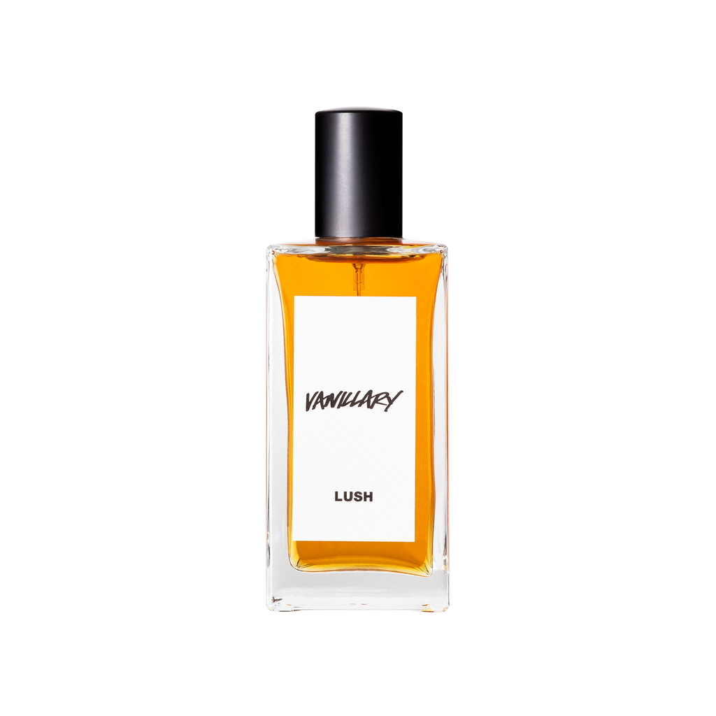 A glass perfume bottle filled with dark amber liquid. A white label reads 'Vanillary'.